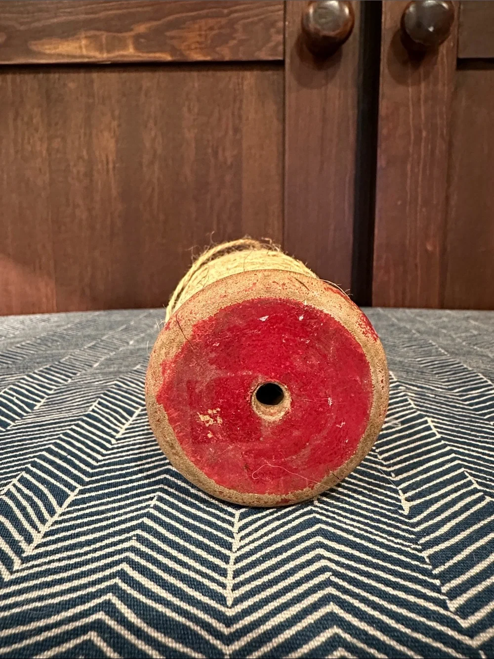 Vintage wooden spool with twine • scissors